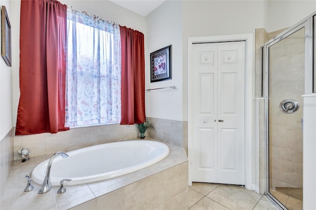 bathroom with tile patterned flooring and a shower with shower door