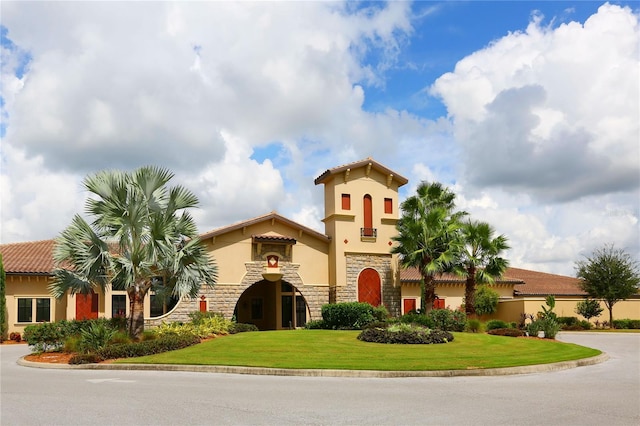 335 River Enclave Ct, Bradenton, FL 34212 - view of front of property with stucco siding, stone siding, and a front yard