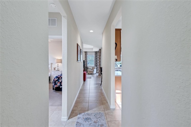 335 River Enclave Ct, Bradenton, FL 34212 - hall featuring a textured wall and light tile patterned floors