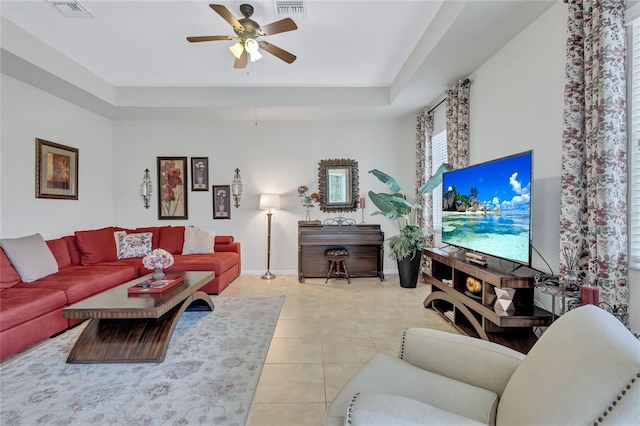 tiled living room with ceiling fan