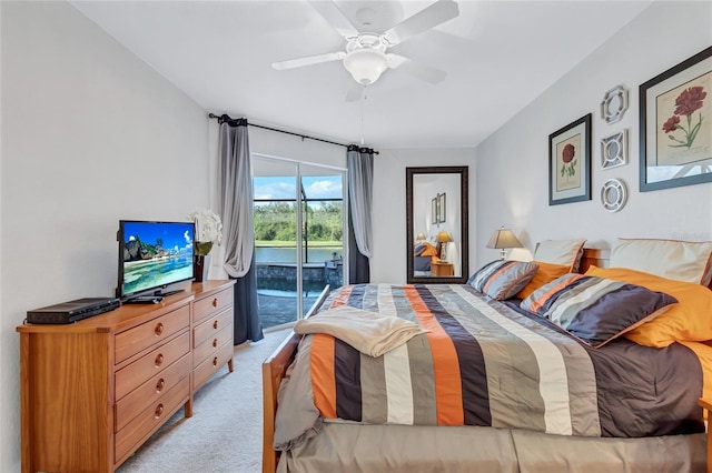 carpeted bedroom with access to outside and ceiling fan