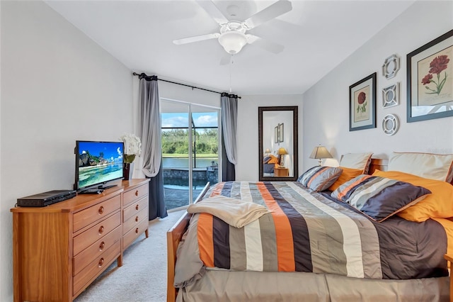335 River Enclave Ct, Bradenton, FL 34212 - bedroom with access to outside, light carpet, and a ceiling fan