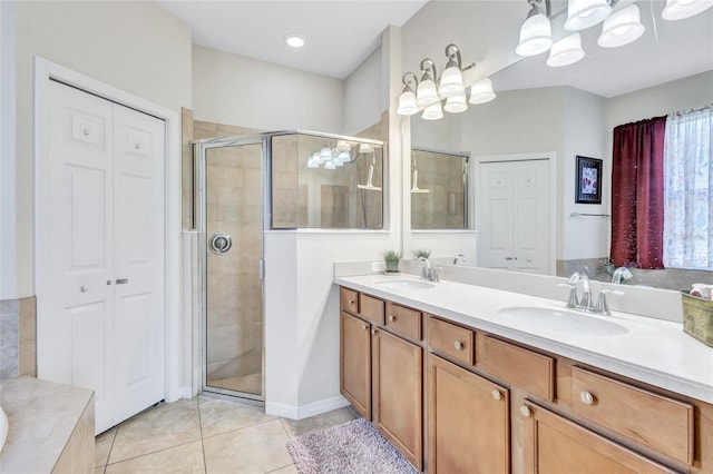 bathroom featuring vanity, walk in shower, and tile patterned flooring