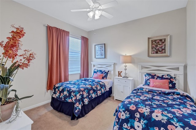 bedroom with light carpet and ceiling fan