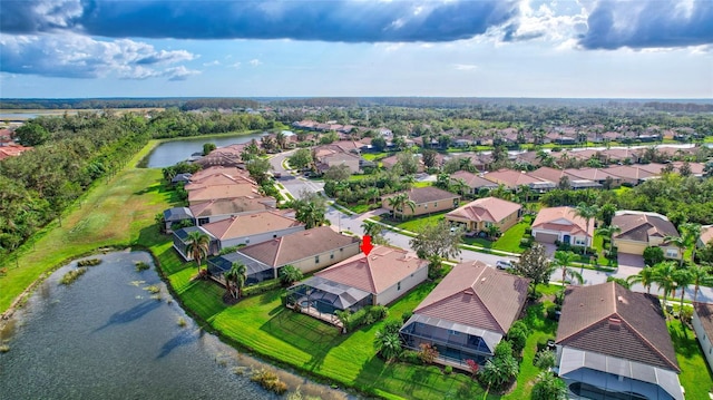 bird's eye view with a water view