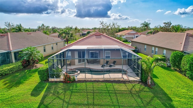 335 River Enclave Ct, Bradenton, FL 34212 - rear view of house with a patio area, a yard, a pool with connected hot tub, and a tile roof