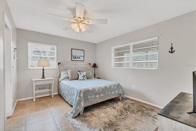 bedroom featuring tile patterned flooring and ceiling fan