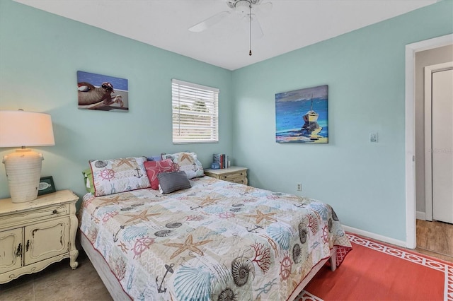 bedroom featuring hardwood / wood-style floors and ceiling fan