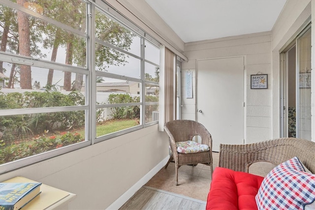 sunroom / solarium featuring healthy amount of natural light