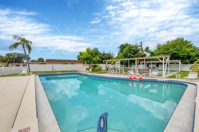 view of swimming pool with a fenced backyard