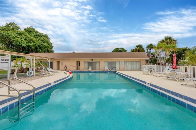 view of swimming pool with a patio area