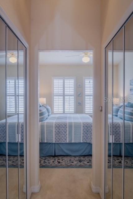 bedroom with light colored carpet