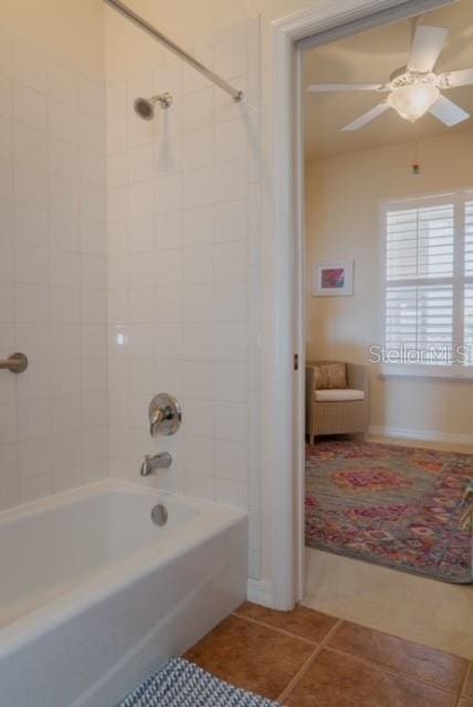 bathroom with tile patterned flooring, tiled shower / bath combo, and ceiling fan