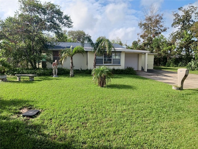 single story home featuring a front yard and a garage