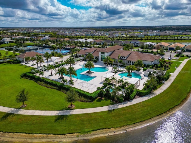 birds eye view of property featuring a water view