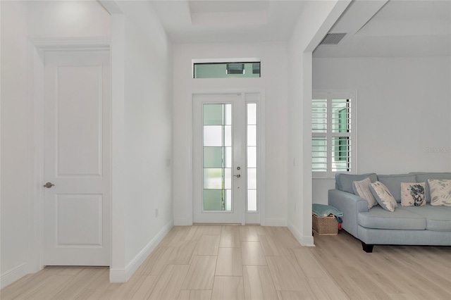 foyer entrance with light hardwood / wood-style floors