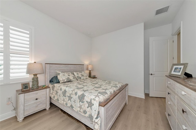 bedroom with light hardwood / wood-style floors