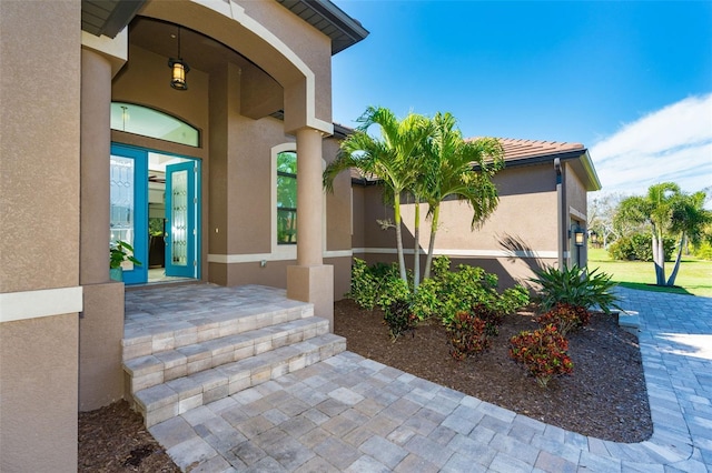 85 Spaniards Rd, Placida, FL 33946 - view of exterior entry featuring stucco siding