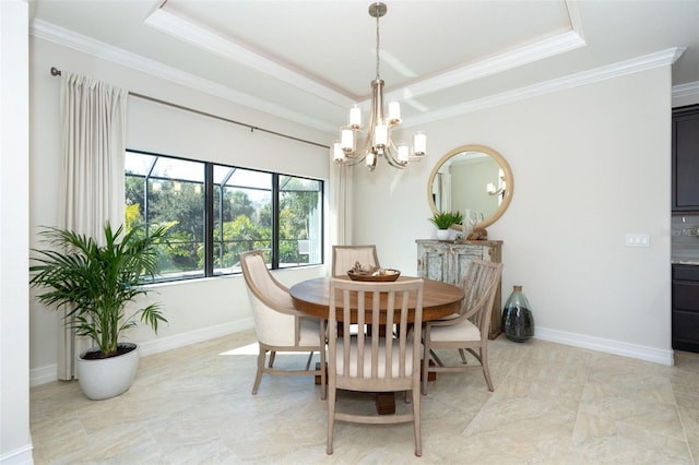 dining area with crown molding, a chandelier, and a raised ceiling