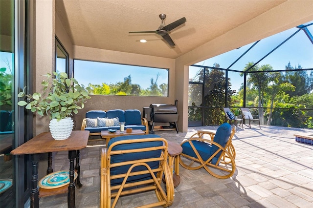 view of patio featuring an outdoor hangout area, a lanai, and ceiling fan