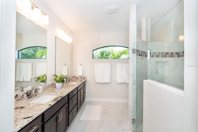 bathroom featuring vanity and tiled shower