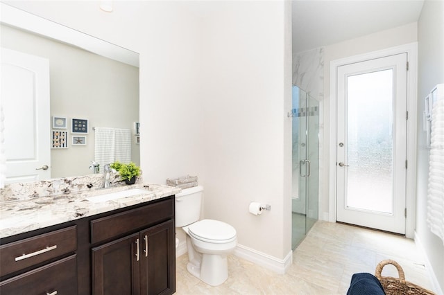 bathroom with walk in shower, vanity, toilet, and tile patterned floors