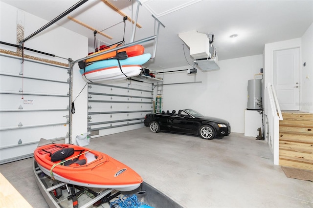 garage featuring water heater and a garage door opener