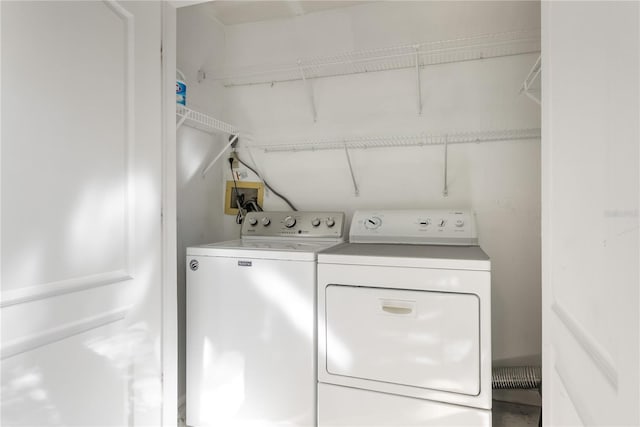 laundry room with independent washer and dryer