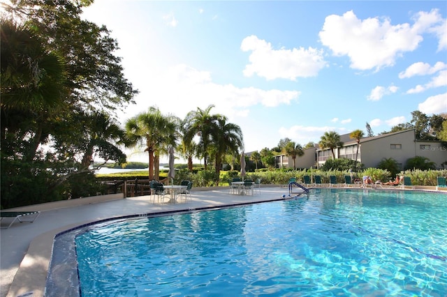 view of swimming pool with a patio area