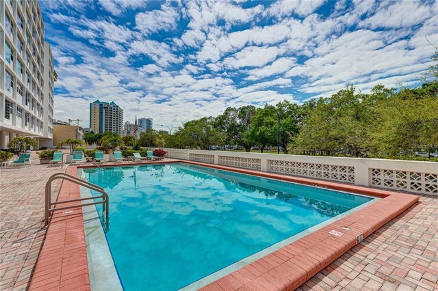 view of swimming pool with a patio area