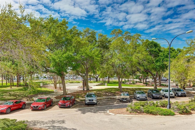 view of property's community featuring uncovered parking