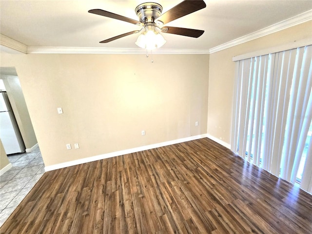 empty room with ornamental molding, light hardwood / wood-style flooring, and ceiling fan