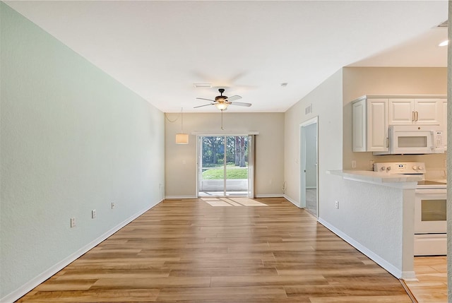 unfurnished living room with ceiling fan and light hardwood / wood-style floors