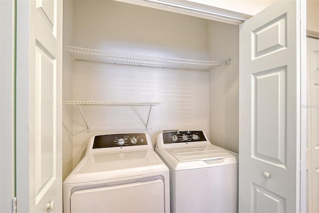 laundry area with washer and clothes dryer