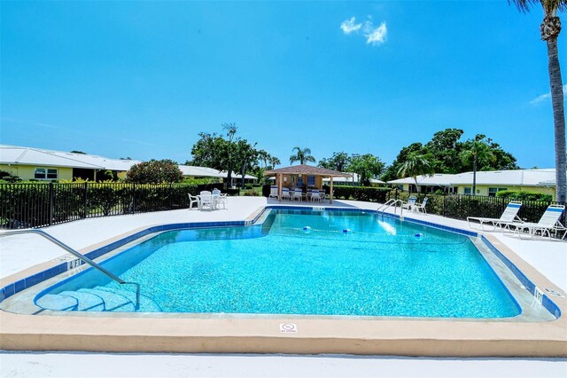 3712 Hampshire Ln Unit 5623, Sarasota, FL 34232 - community pool with fence, a patio, and a gazebo