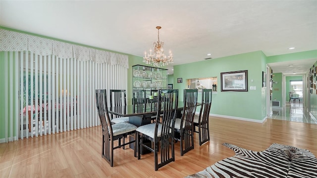 3712 Hampshire Ln Unit 5623, Sarasota, FL 34232 - dining room with a chandelier, light wood-style flooring, baseboards, and recessed lighting