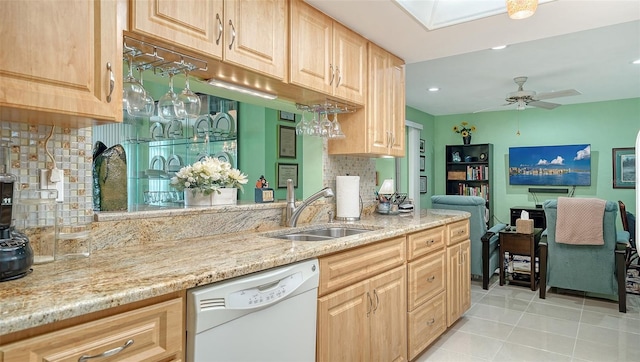 3712 Hampshire Ln Unit 5623, Sarasota, FL 34232 - kitchen with dishwasher, light brown cabinetry, a sink, tasteful backsplash, and light tile patterned floors