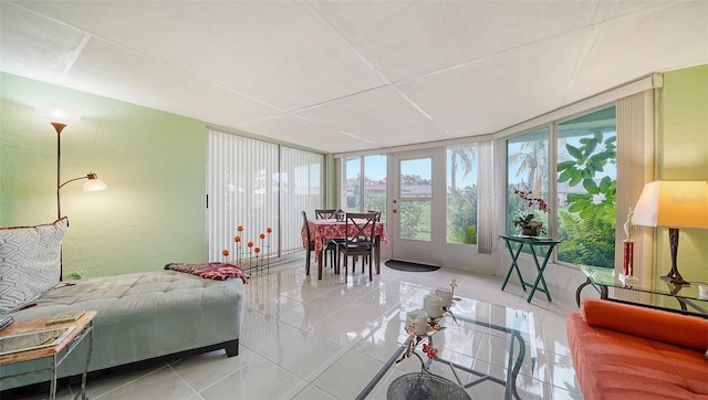 interior space featuring a wall of windows and tile patterned floors