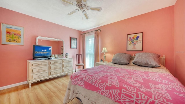 bedroom featuring ceiling fan and light hardwood / wood-style floors