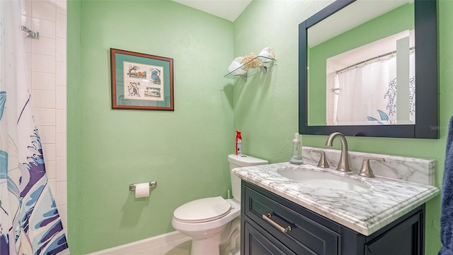 bathroom featuring toilet, a shower with curtain, and vanity