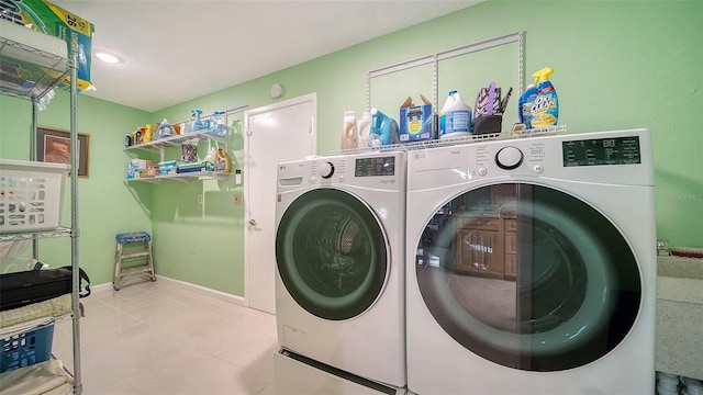 3712 Hampshire Ln Unit 5623, Sarasota, FL 34232 - washroom with washer and dryer and tile patterned flooring