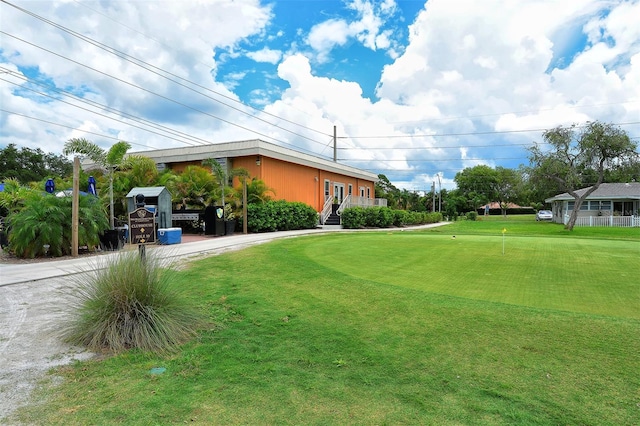 3712 Hampshire Ln Unit 5623, Sarasota, FL 34232 - view of green lawn with an area to practice putting