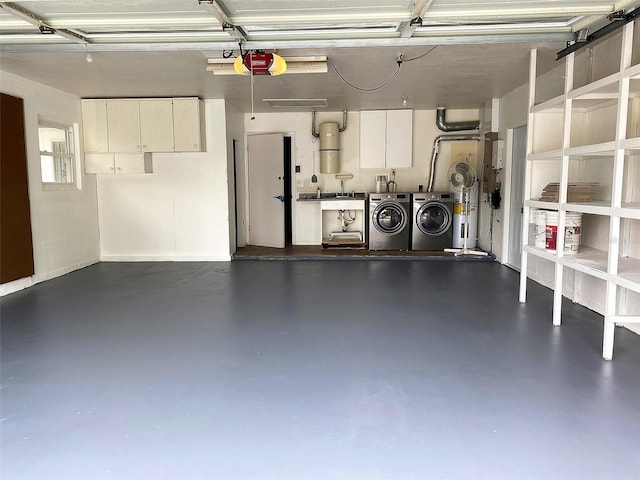 garage with a garage door opener and washing machine and dryer