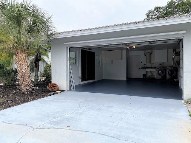 garage featuring washer and clothes dryer