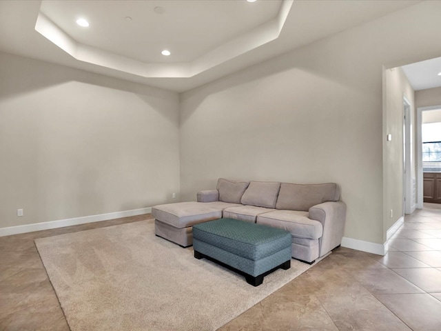 living room with a tray ceiling