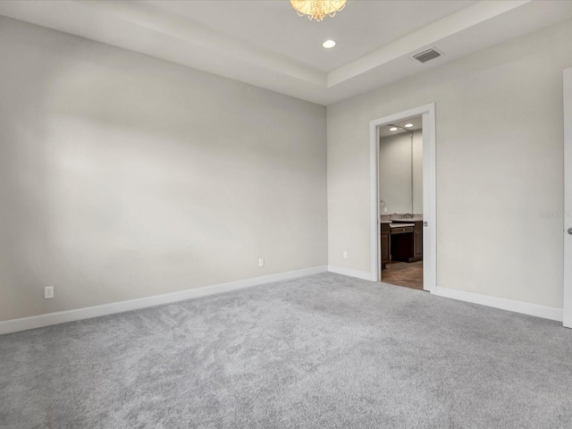 spare room with dark carpet