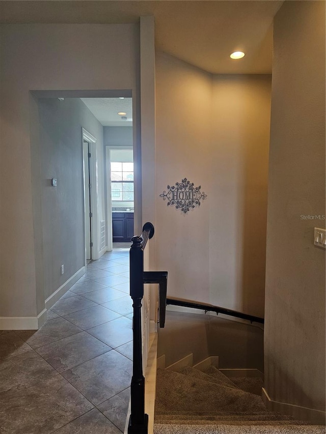 stairs with tile patterned floors