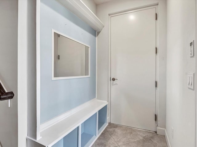 mudroom with light tile patterned flooring