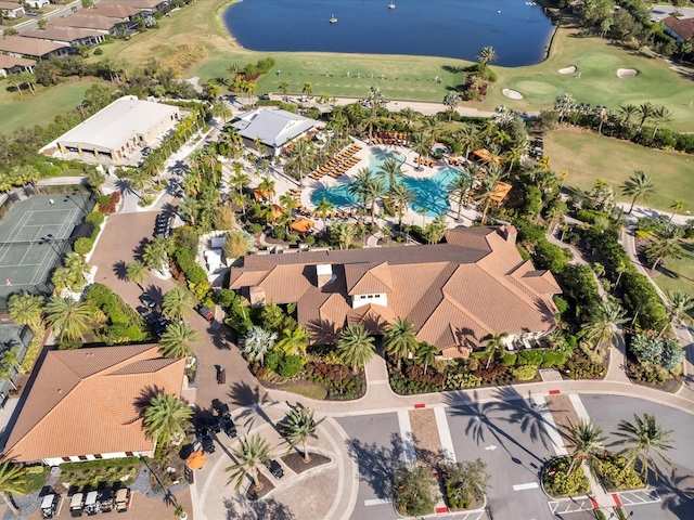 birds eye view of property with a water view