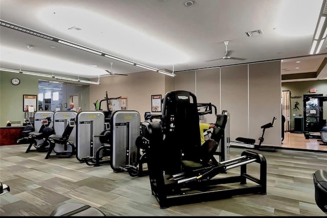 workout area featuring ceiling fan